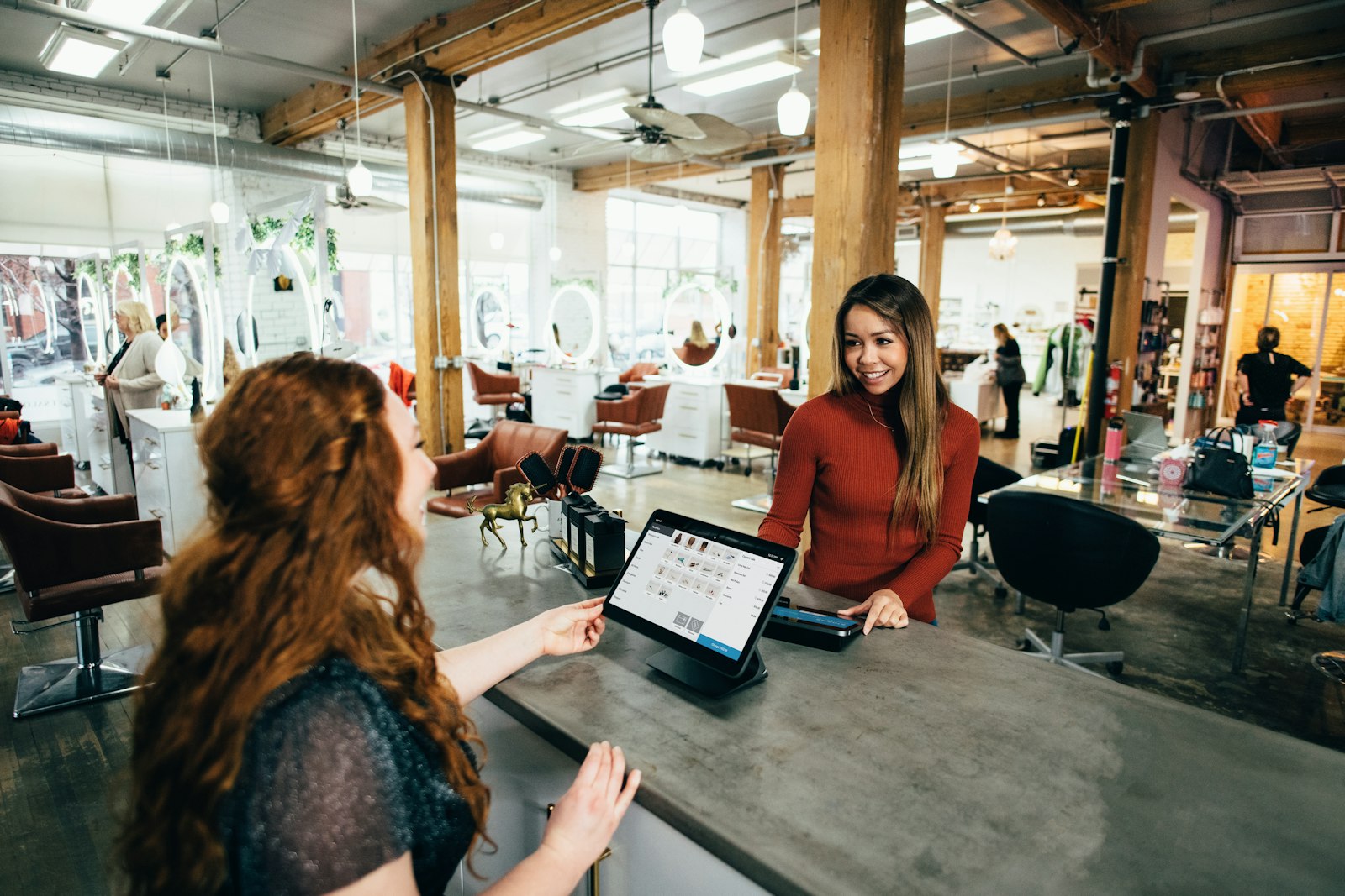 A small business team reviewing work on a laptop